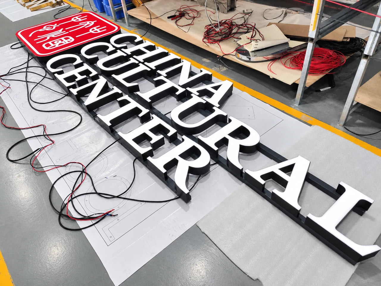Authentic workshop photograph of the China Cultural Center sign during manufacture.