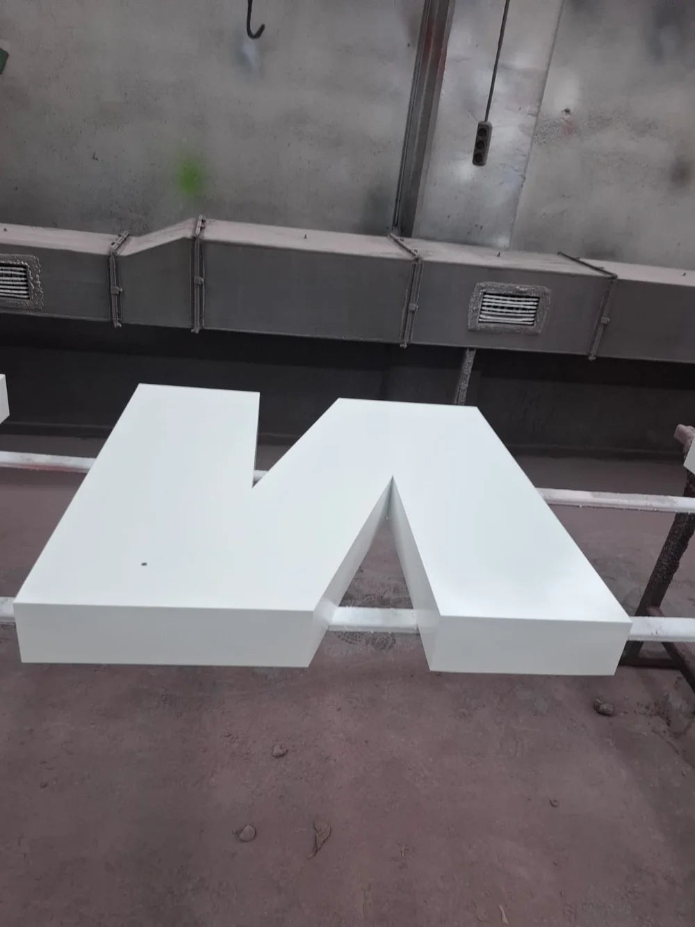 White channel letters being made in the workshop.