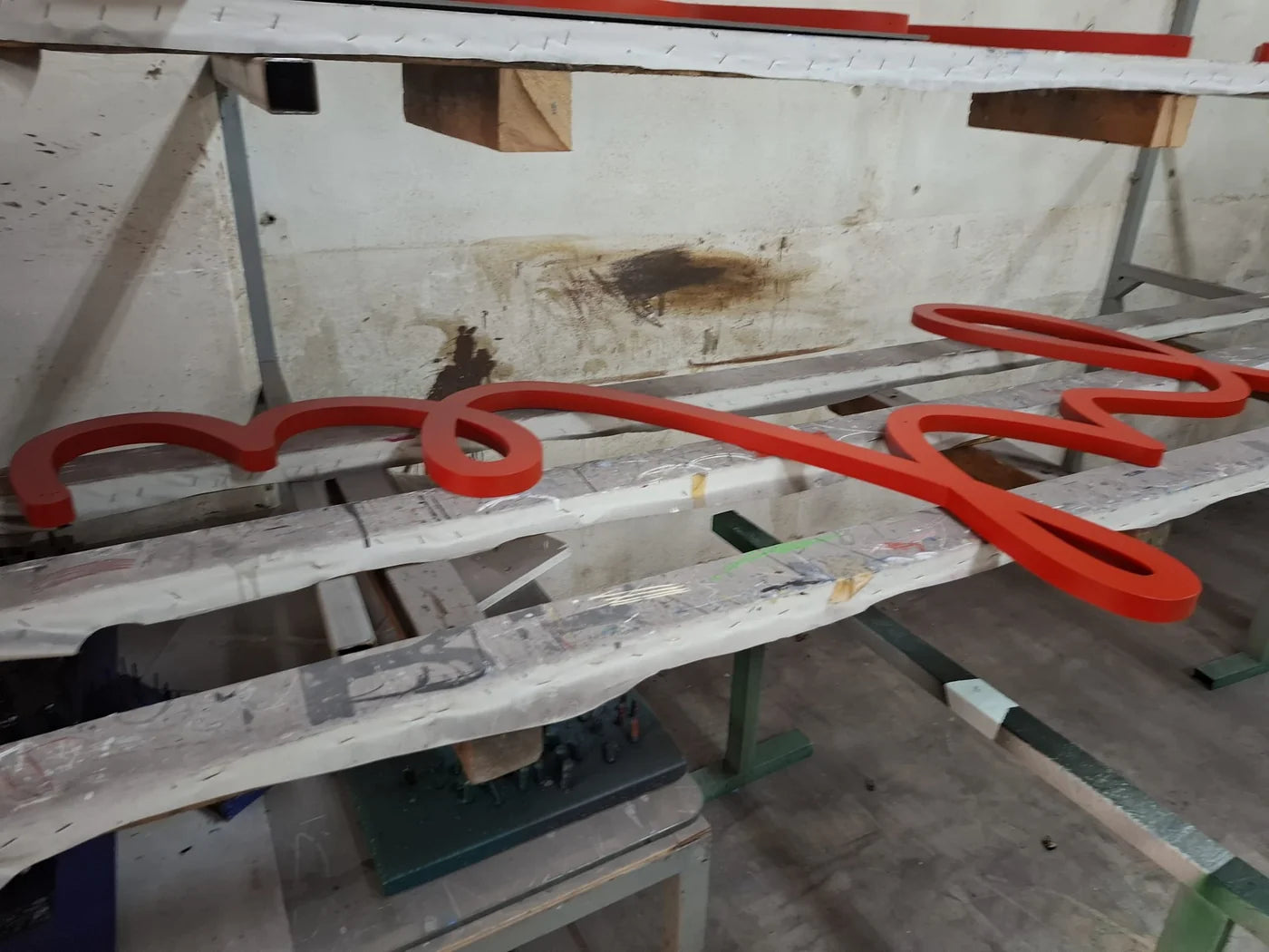 Sections of the red Jean Tinguely script being made in the workshop.