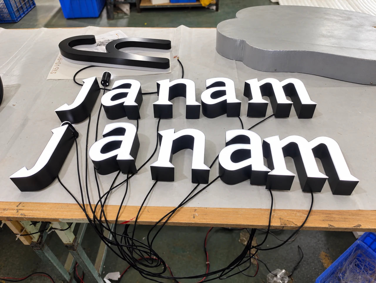 Authentic workshop photograph of the janam sign during manufacture.