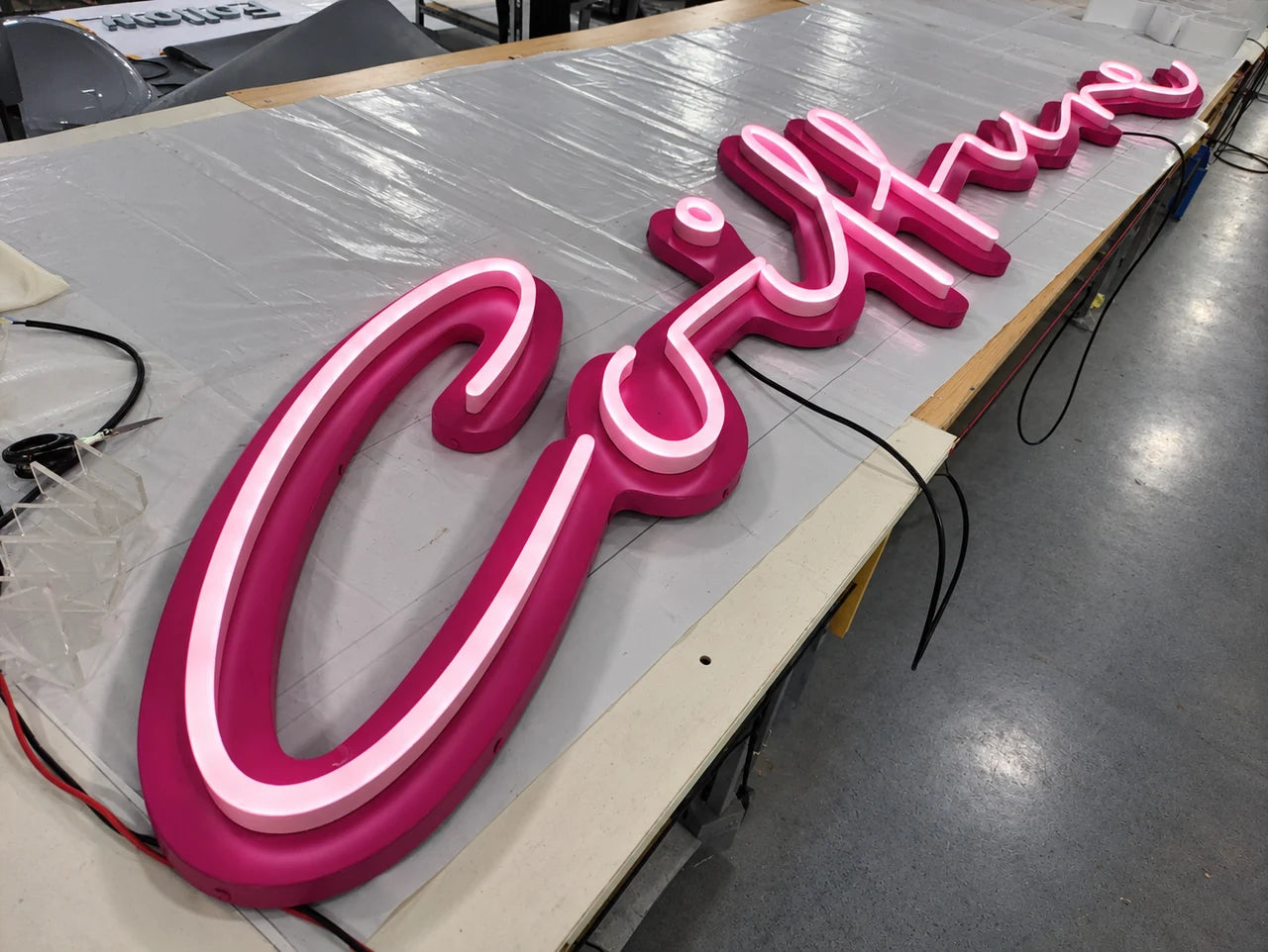 Authentic workshop photograph of the Coiffure sign during manufacture.