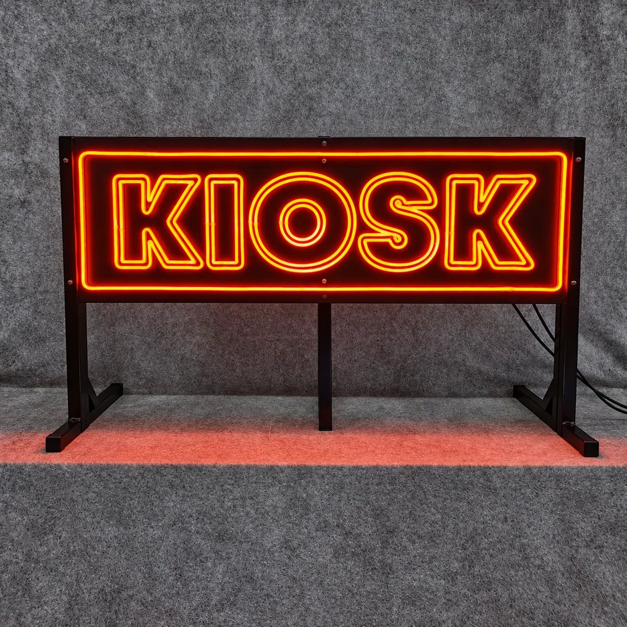 Authentic workshop photograph of the KIOSK sign during manufacture.