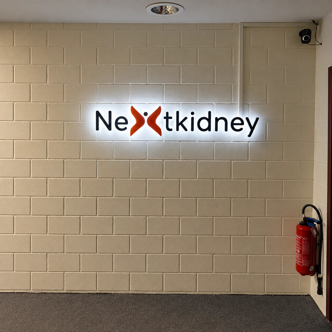 Completed backlit Nextkidney logo installed in Lausanne.
